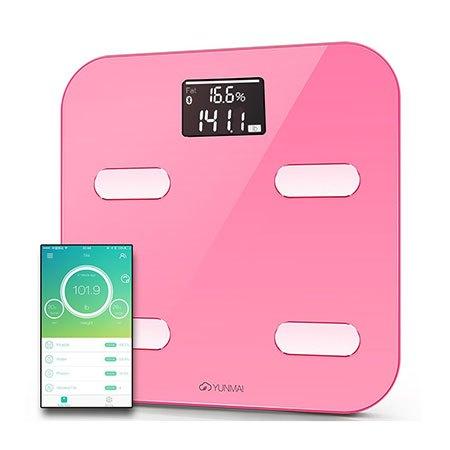 Yunmai smart color scale next to a smartphone